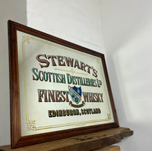 Load image into Gallery viewer, Stunning mid-century Stewart’s Edinburgh Scotch whisky mirror featuring a perfect image of the historical Scottish design, elegant Victorian style font in a selection of different styles with vivid finish.

